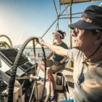 Daniela Bärnthaler and Christian Schiester runnung and sailing at the Ionian Sea in Greece on July 2016